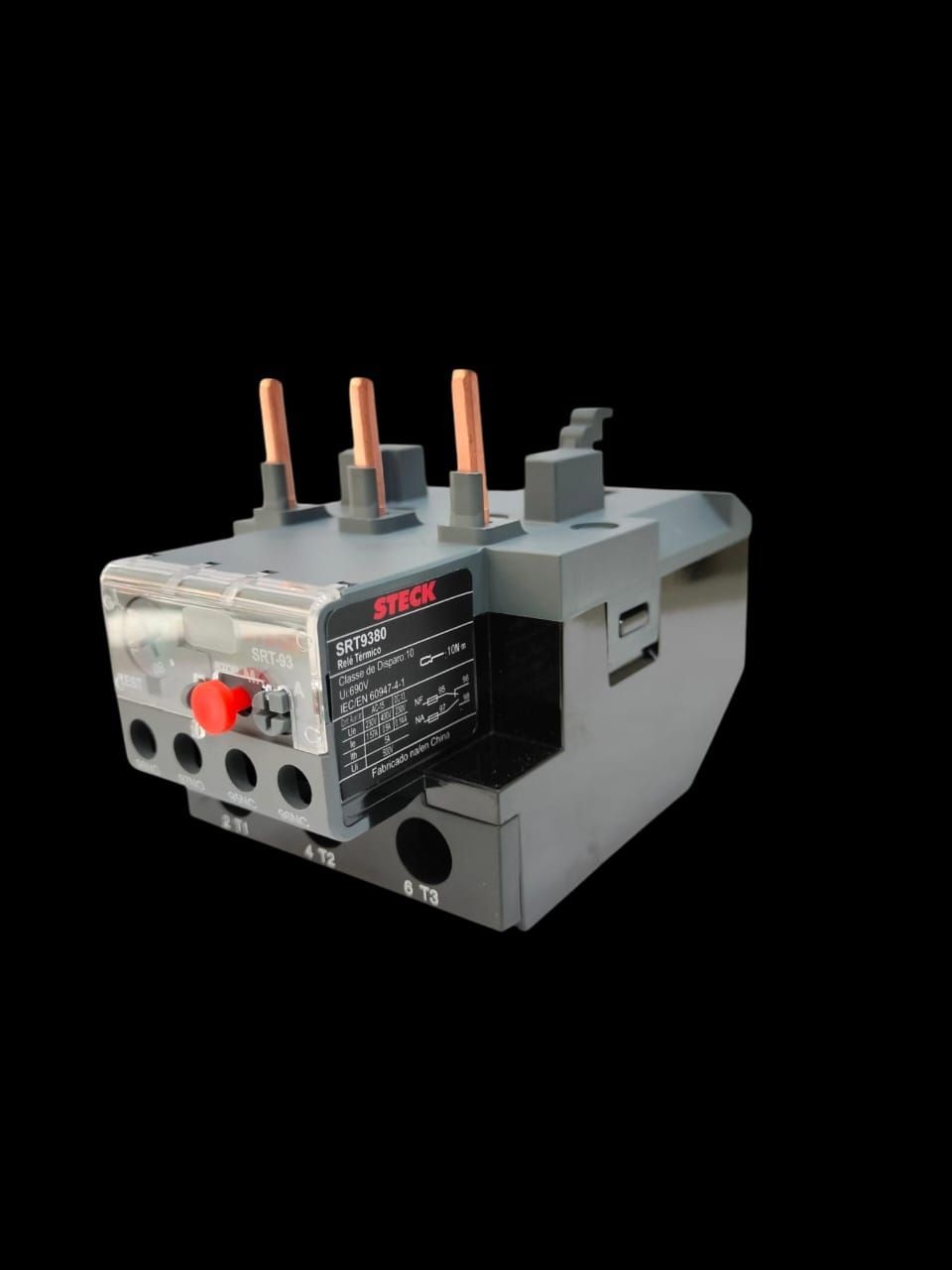 Industrial relay with copper terminals and control panel on black background.